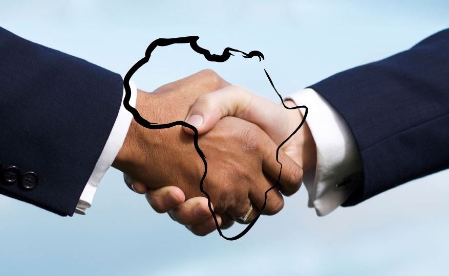 Handshake over a map of Africa
